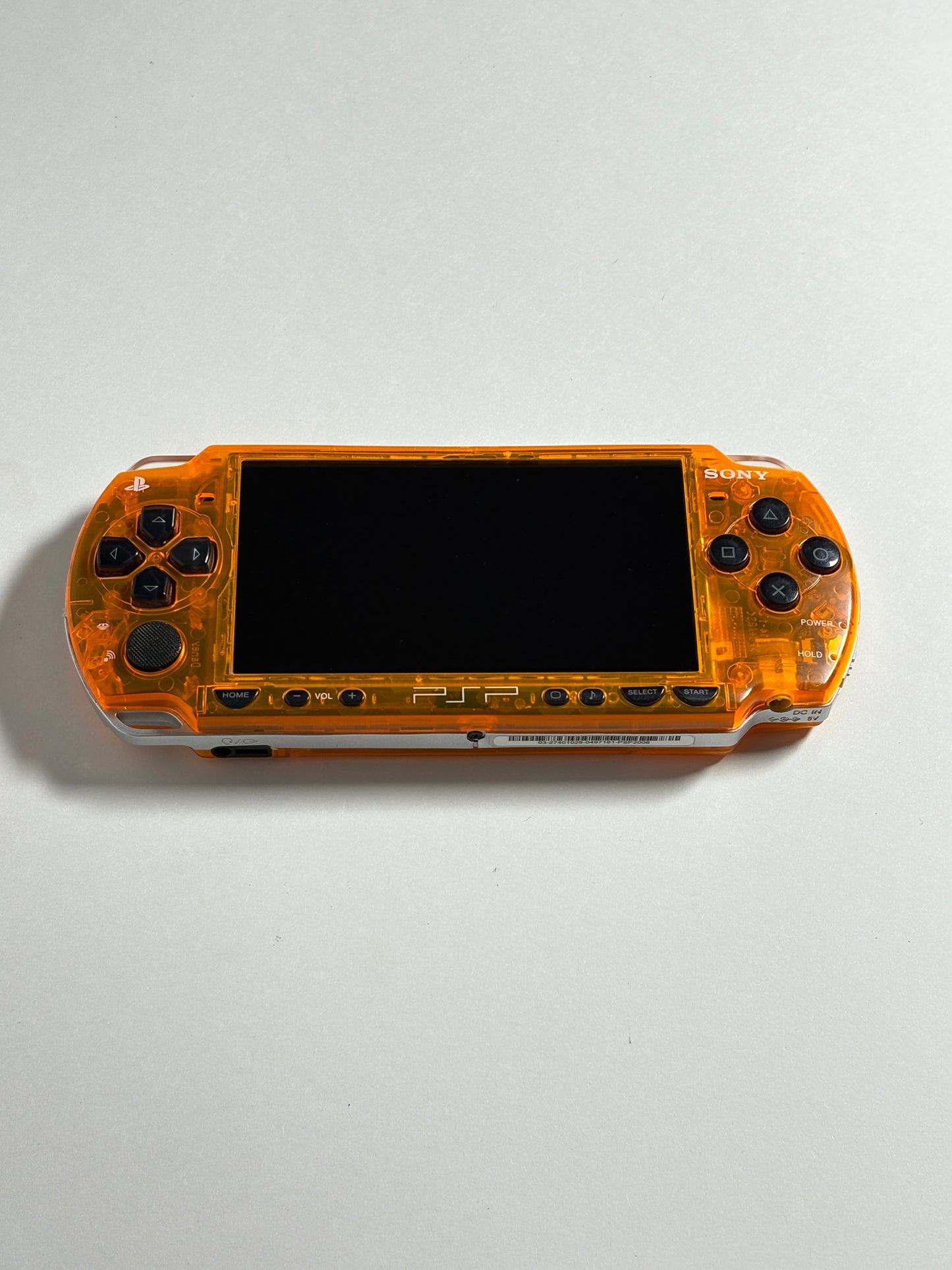 PSP 2000 - Transparent orange w black buttons