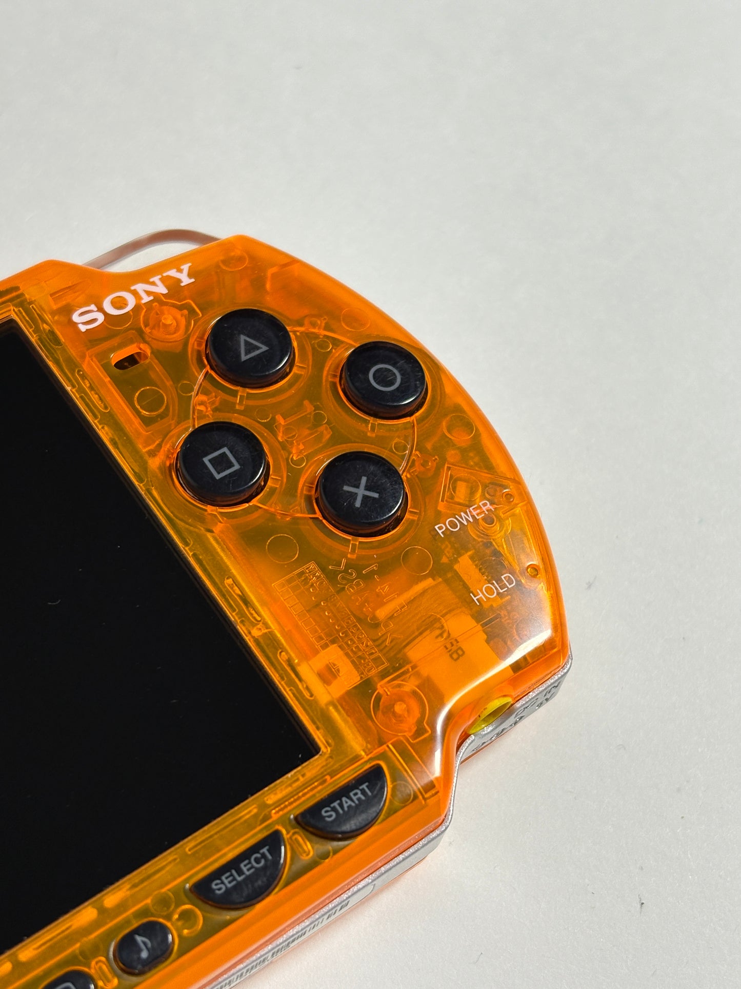 PSP 2000 - Transparent orange w black buttons